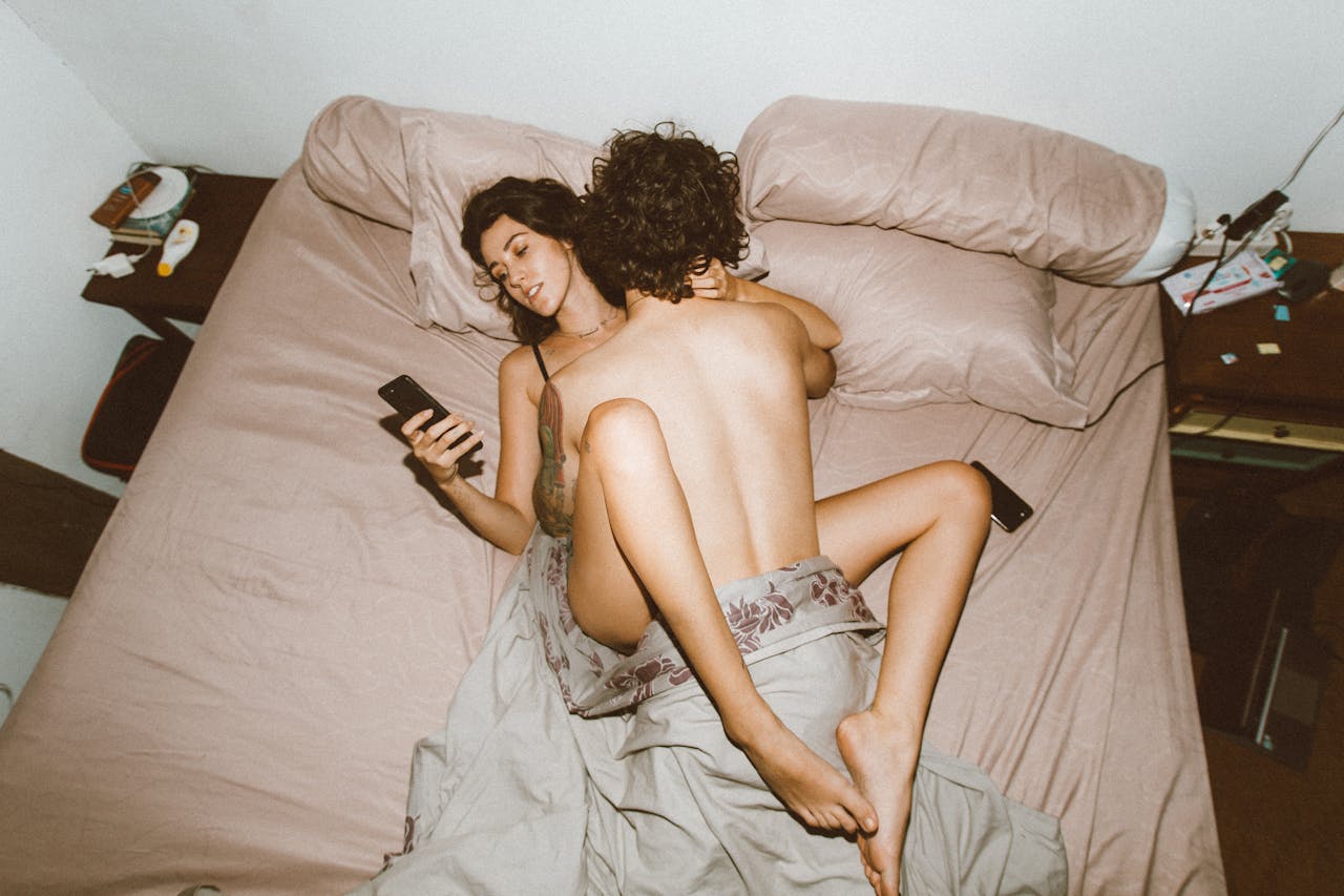 Couple exploring intimacy with app-connected pleasure device